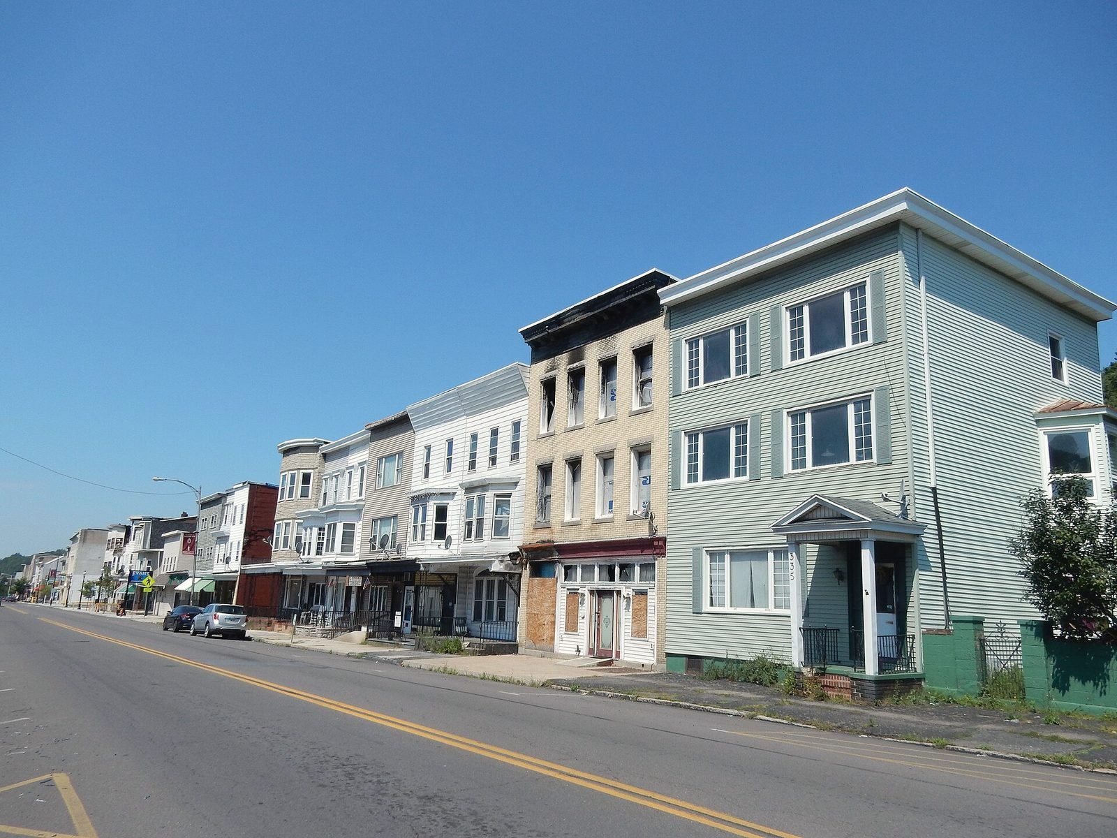 A long row of attached rowhouses along Centre Street in Mahanoy City